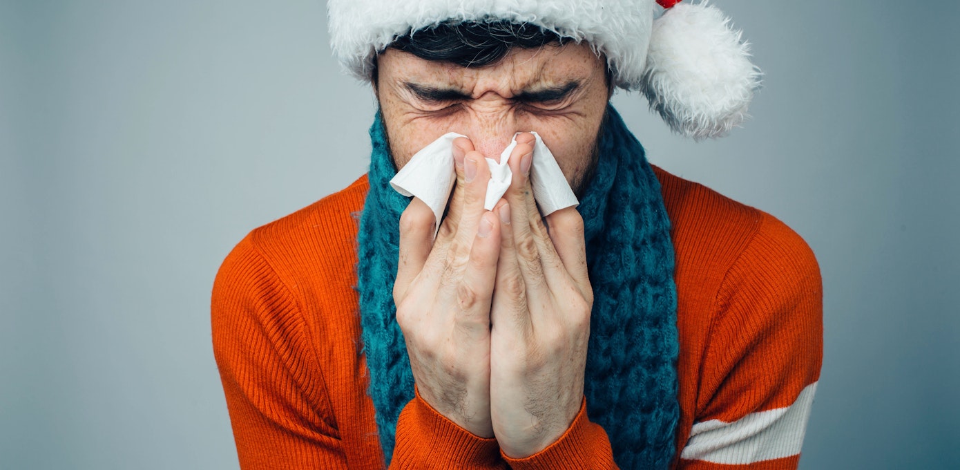 An image depicting a person suffering from common cold symptoms