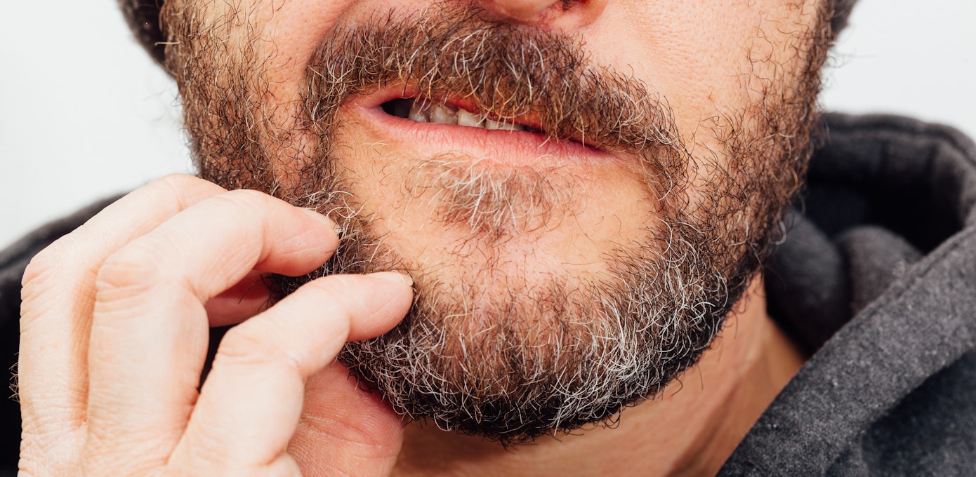An image depicting a person suffering from face itch symptoms
