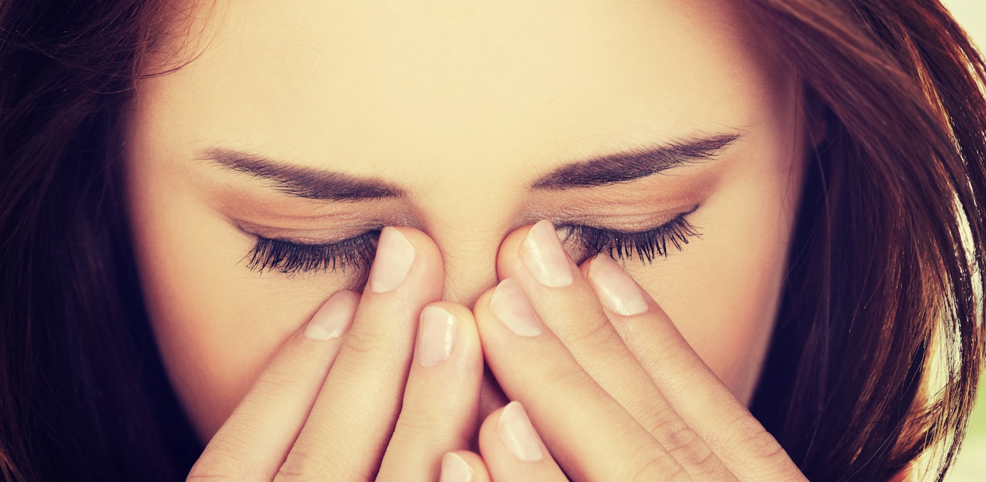 An image depicting a person suffering from facial fullness or pressure symptoms