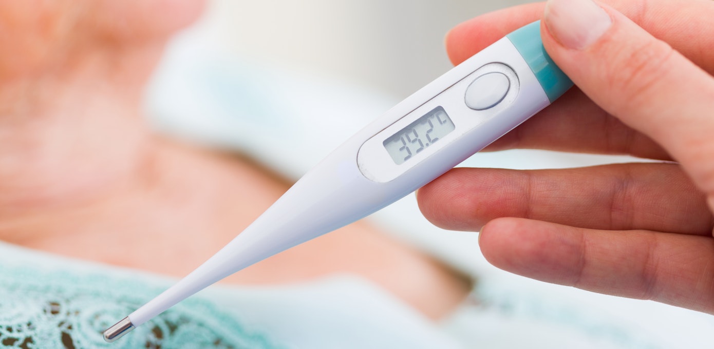 An image depicting a person suffering from fever symptoms