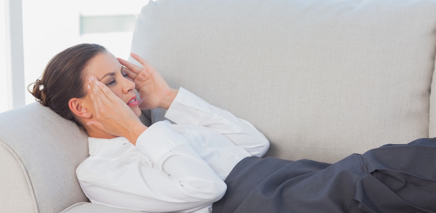 An image depicting a person suffering from headache near both temples symptoms
