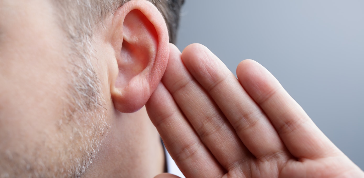 An image depicting a person suffering from hearing loss in one ear symptoms