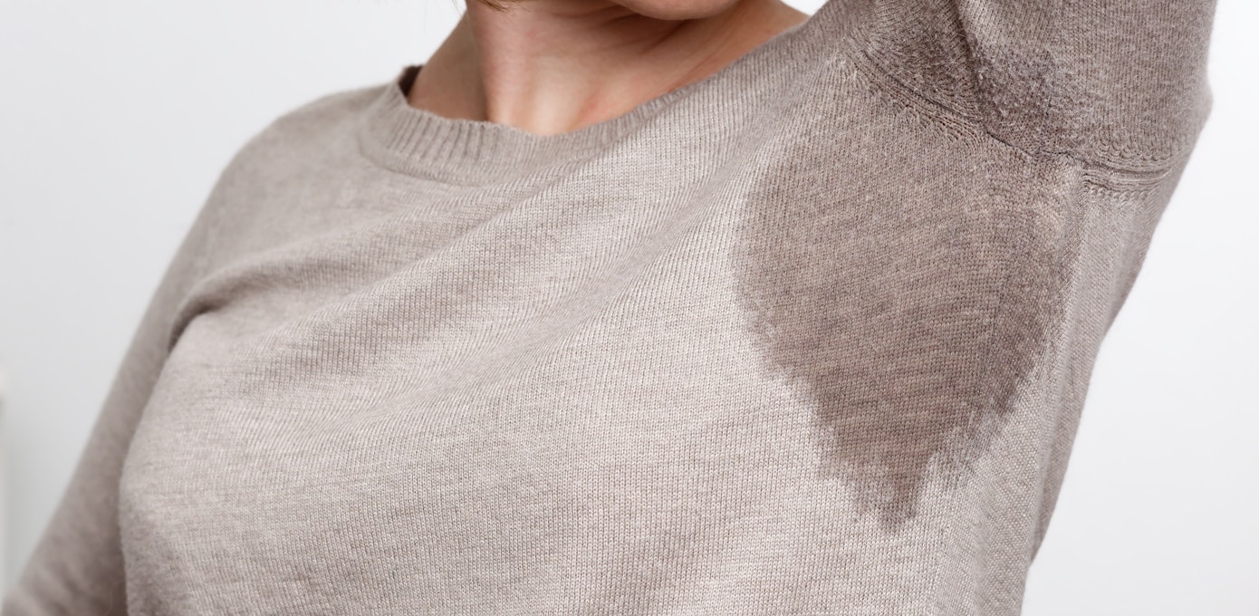 An image depicting a person suffering from hot flash symptoms