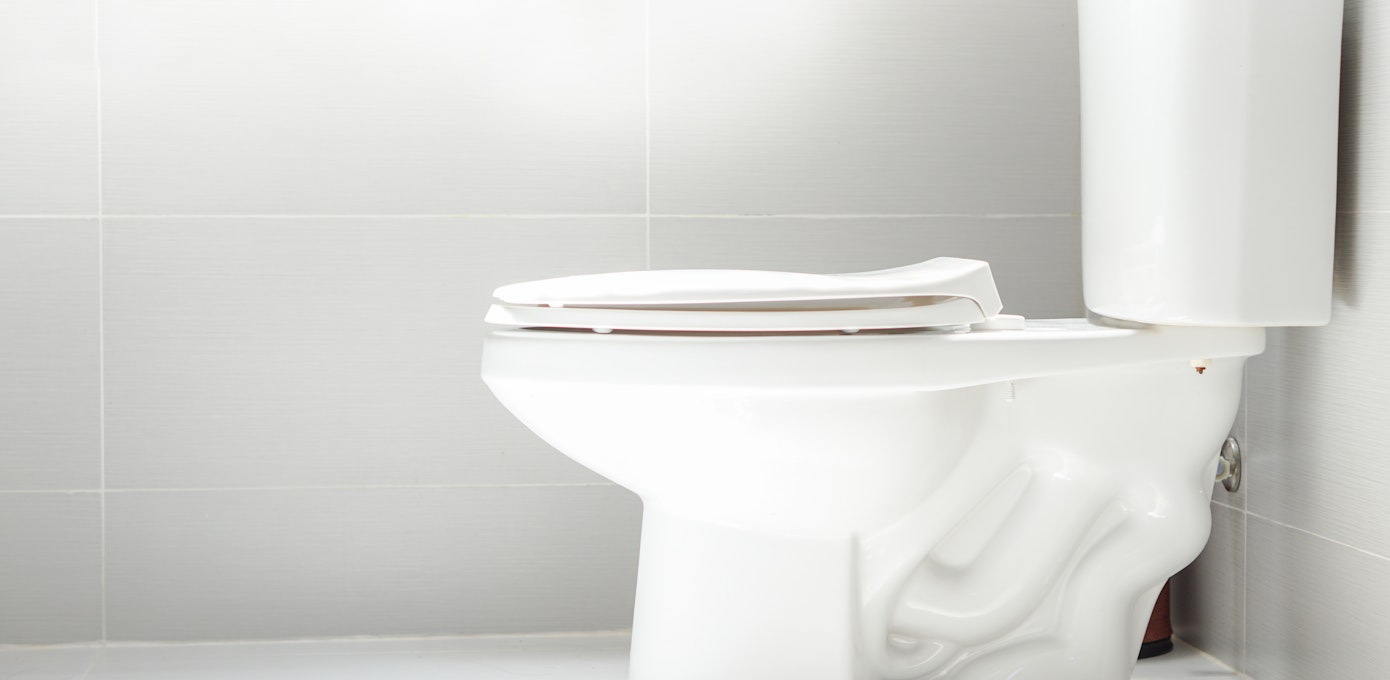 An image depicting a person suffering from large amount of stool change symptoms