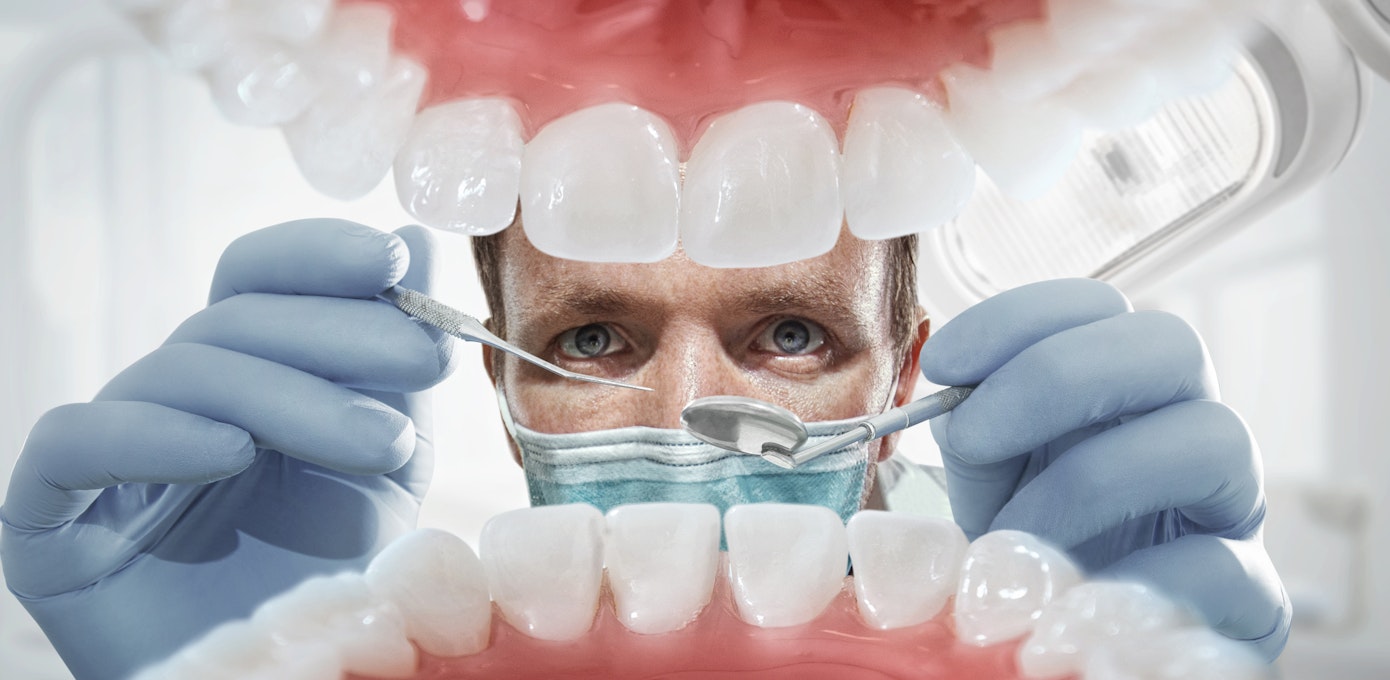 An image depicting a person suffering from lesions on the roof of the mouth symptoms