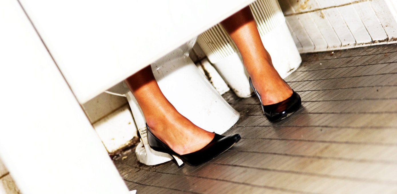 An image depicting a person suffering from less than normal urination symptoms