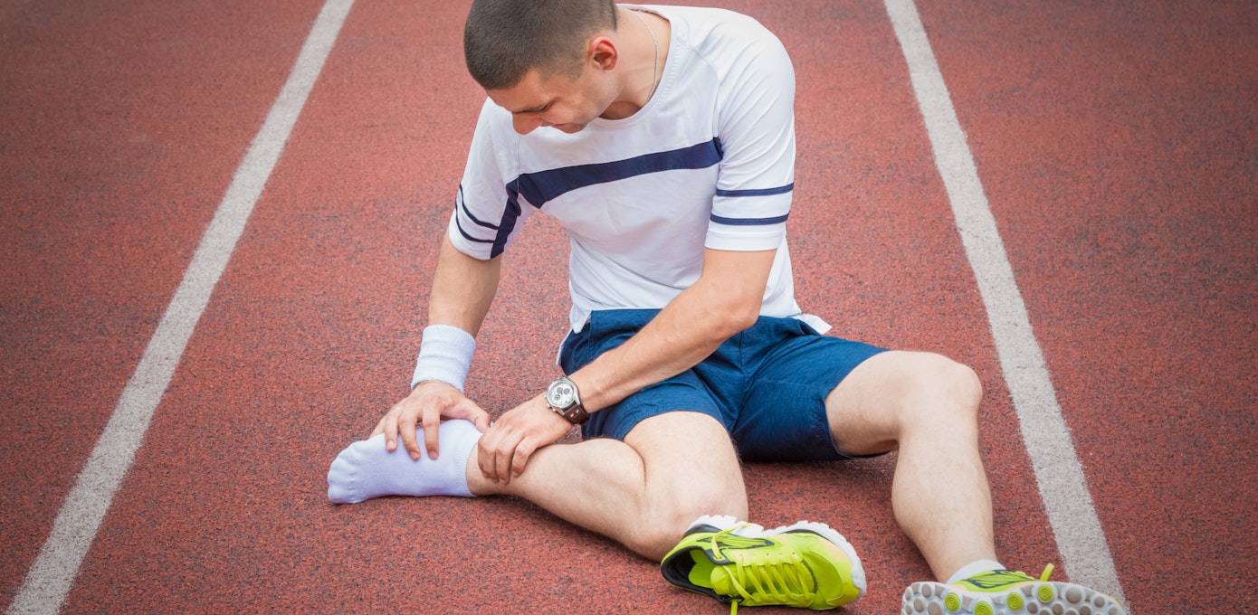 An image depicting a person suffering from severe ankle pain symptoms
